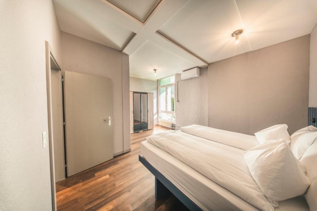 HOP Flow Suite Family Zweites Schlafzimmer Einzelbetten Interlaken